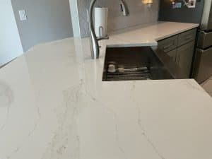 Modern quartz kitchen worktop featuring a sleek design and integrated sink, ideal for contemporary kitchen spaces.